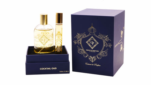Flacone in vetro da 100ml di Cocktail Oud di Oriental Perfumes—un intenso 30% Extrait de Parfum che mostra il ricco colore ambrato di una fragranza artigianale gourmand firmata Oud di Firenze.