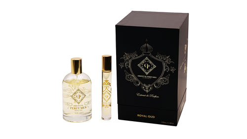 Il flacone da 100ml di Royal Oud accanto al travel spray da viaggio e alla lussuosa confezione regalo nera opaca con stemma dorato firmata Oriental Perfumes Firenze—un perfetto regalo di profumo o souvenir a Firenze.